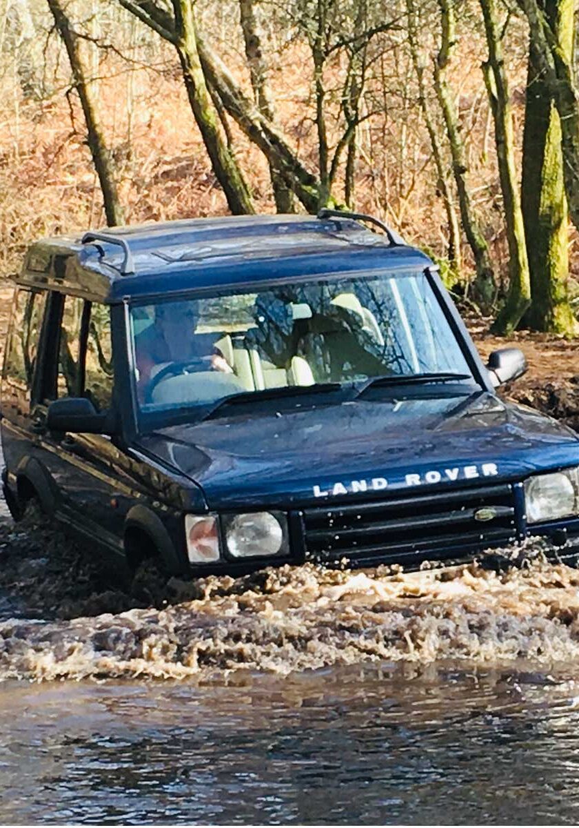 4x4 Tour in Surrey, Land Rover crossing a ford on a Green Lane.